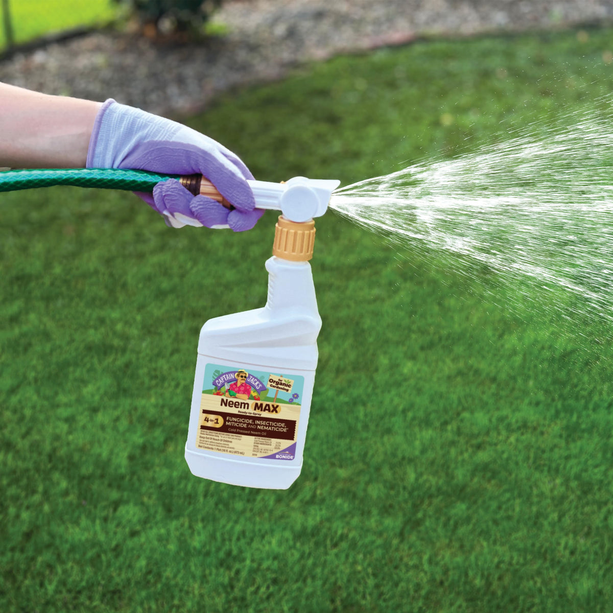 Neem Max spray nozzle shows convenient hose-end attachment for quick application.