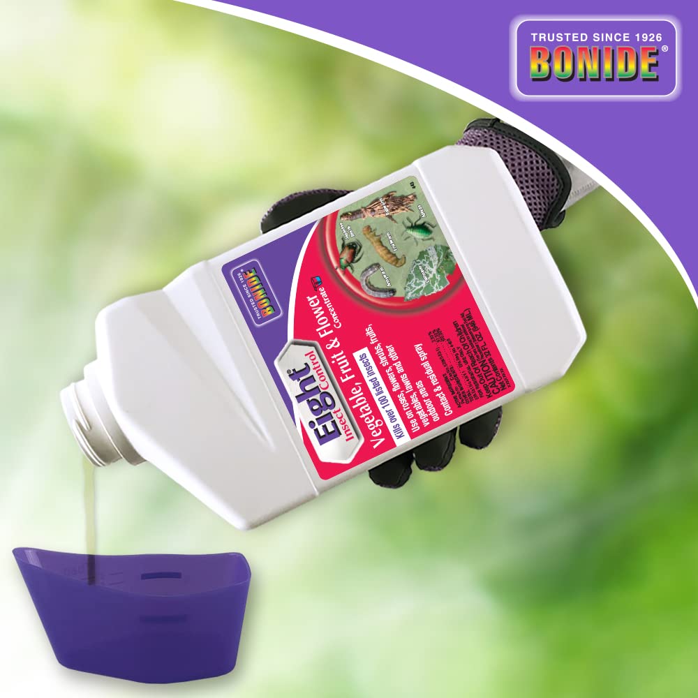 Garden scene with Bonide Eight Insect Control being sprayed on plants.