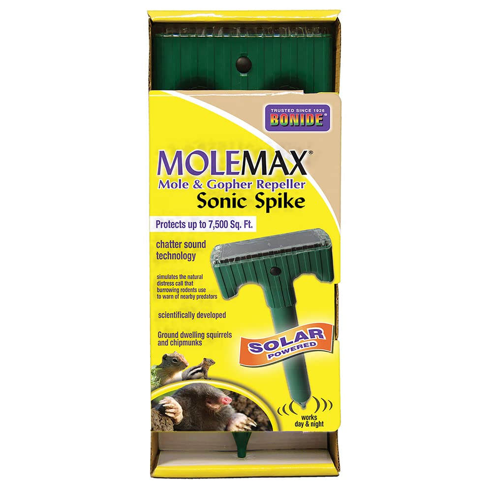 Bonide MoleMax Sonic Spike Repeller in yard for safe pest deterrence.