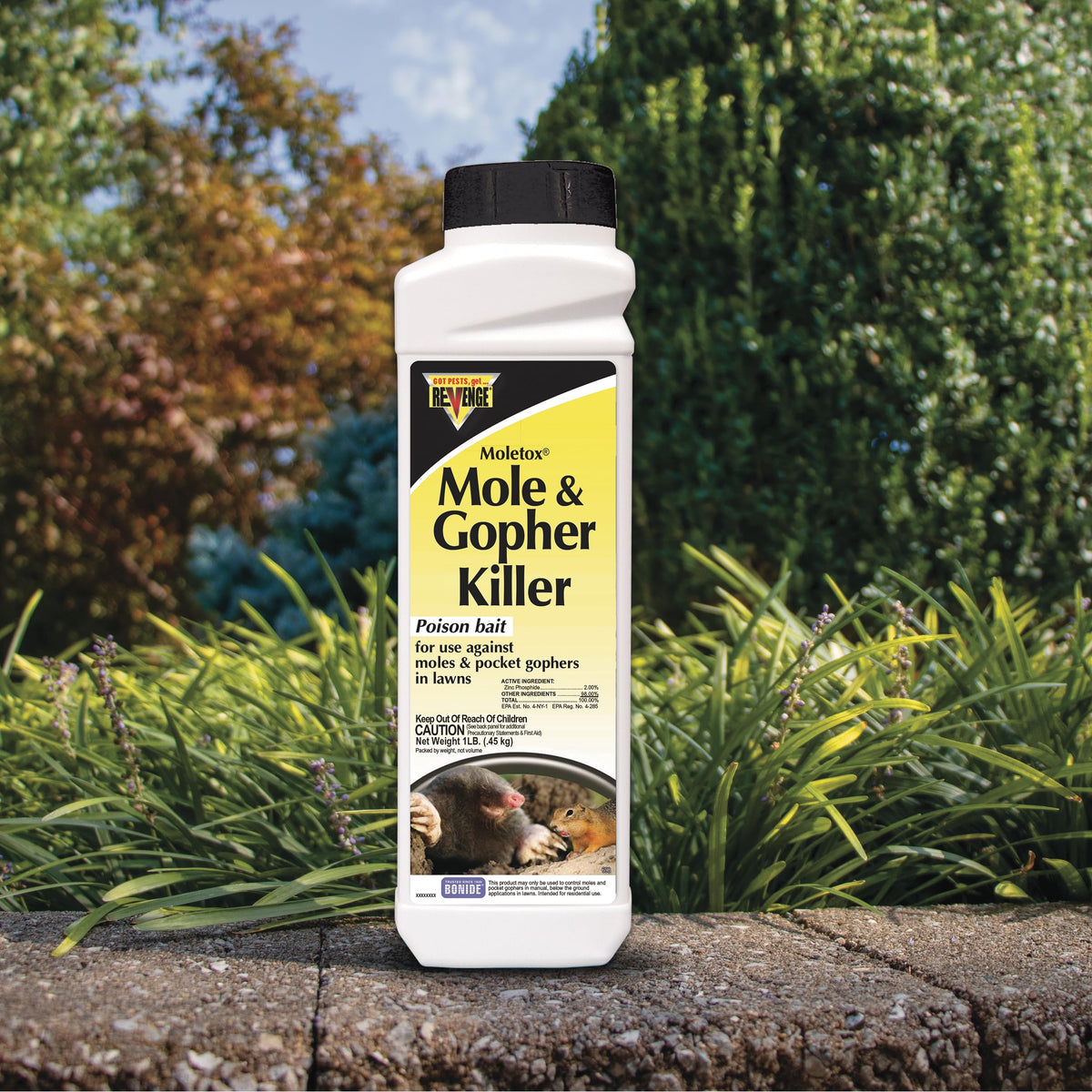 Bonide Revenge Moletox granules bait spread for pocket gopher control.