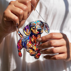 Boyese dachshund suncatcher hanging beside a mirror creates cheerful reflections.
