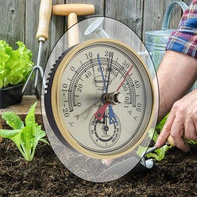 Brannan greenhouse thermometer-hygrometer on wall mount helps gardeners track plant climate easily.