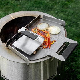 Breeo Griddle Press high-temp handle enables confident live-fire cooking.