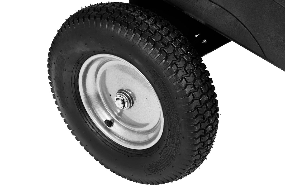 Brinly 15x6 pneumatic tires stabilize movement on uneven surfaces.