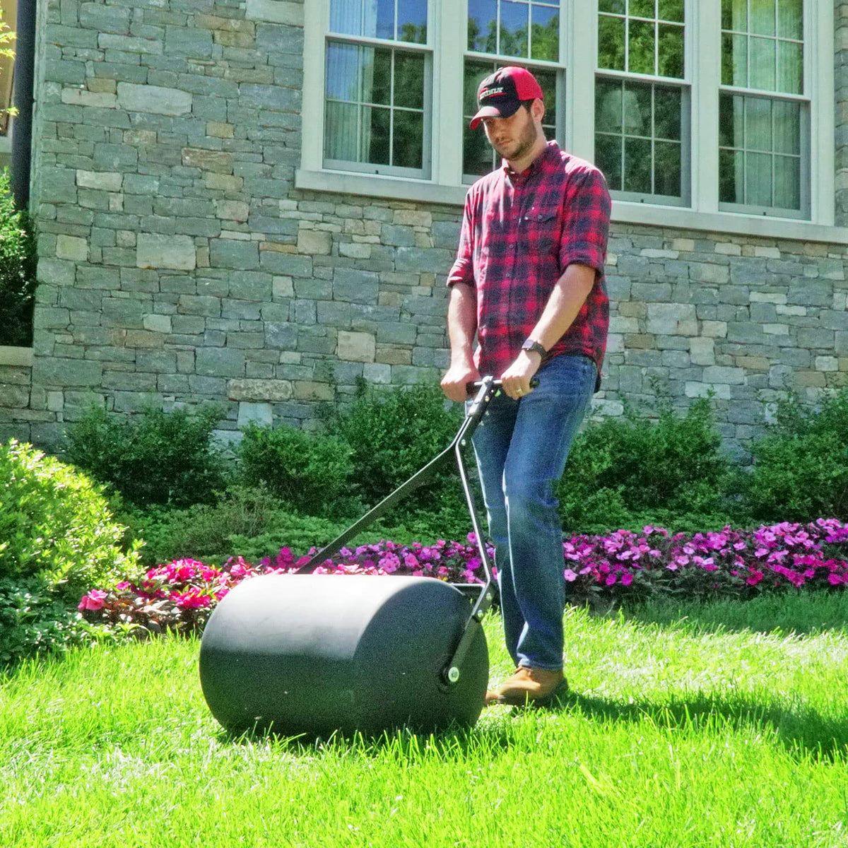 Brinly flat-black lawn roller in outdoor setup