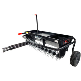Brinly tow behind aerator-spreader assembly for efficient lawn care and even material distribution.