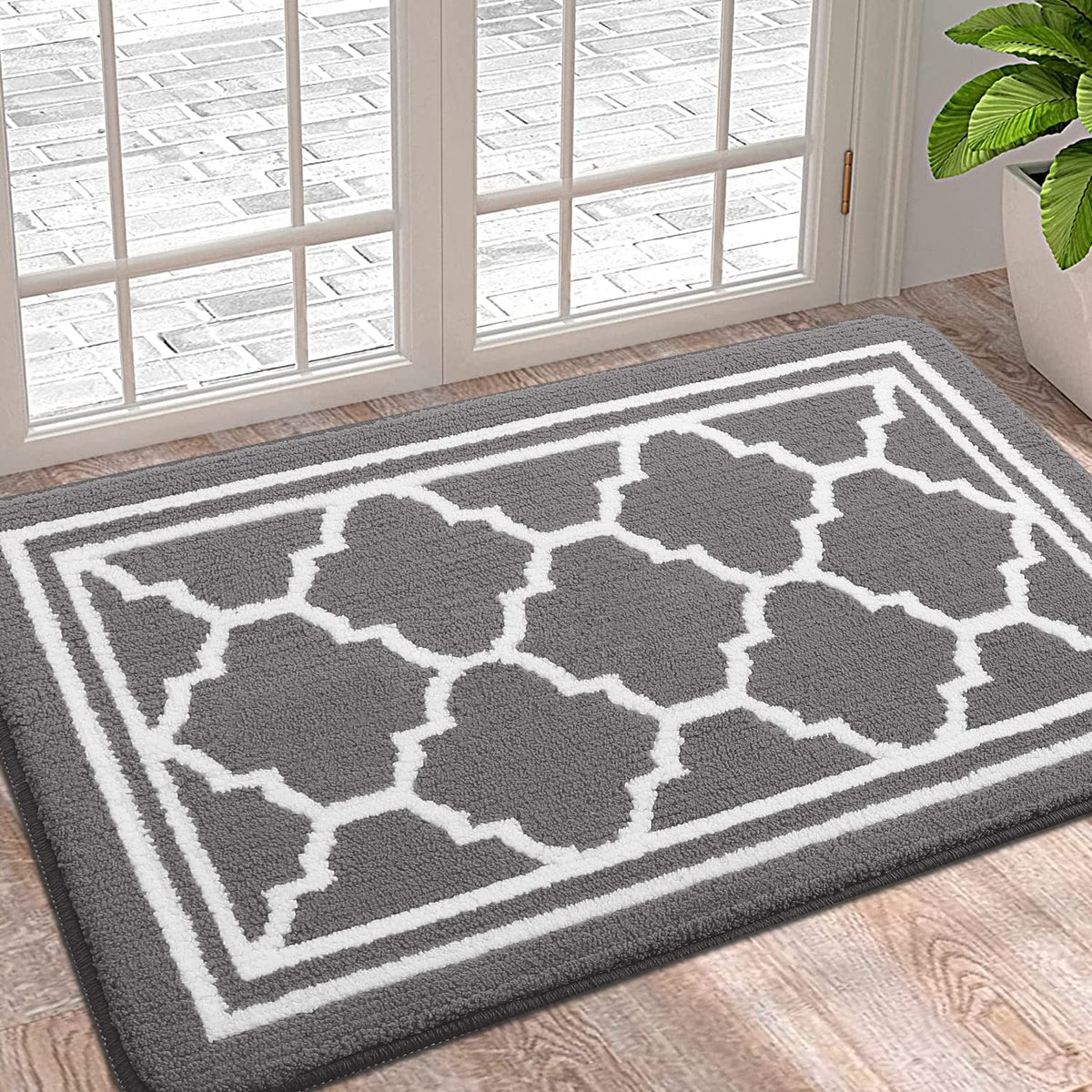 Buganda indoor door mat with a dirt-trapping surface captures mud at the entry.