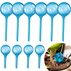 Bvrbaory watering globes large in soil providing steady moisture for potted plants