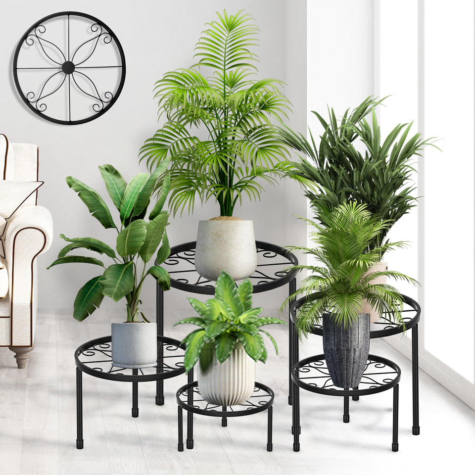 CADANI 5-pack plant stands with varied heights for layered indoor display.