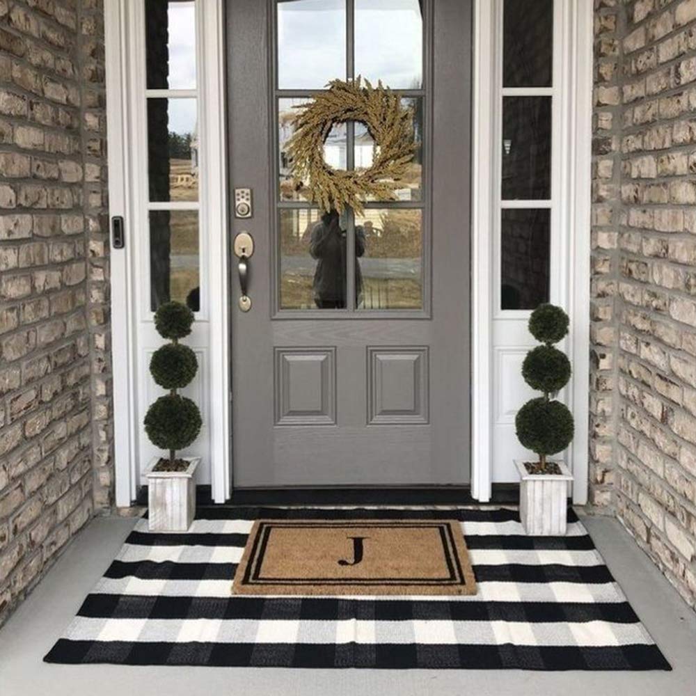 CAINANEL Buffalo Plaid Outdoor Rug on porch providing contrast and curb appeal