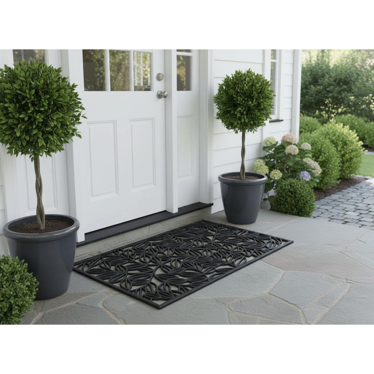 Calloway Mills Lilac Vine rubber doormat on porch with oversized coverage.