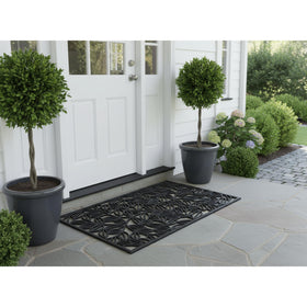 Calloway Mills Lilac Vine rubber doormat on porch with oversized coverage.
