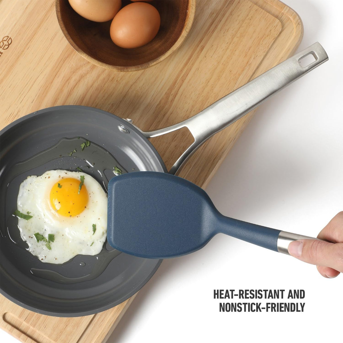 Calphalon Prime navy silicone head resists heat to protect delicate cookware