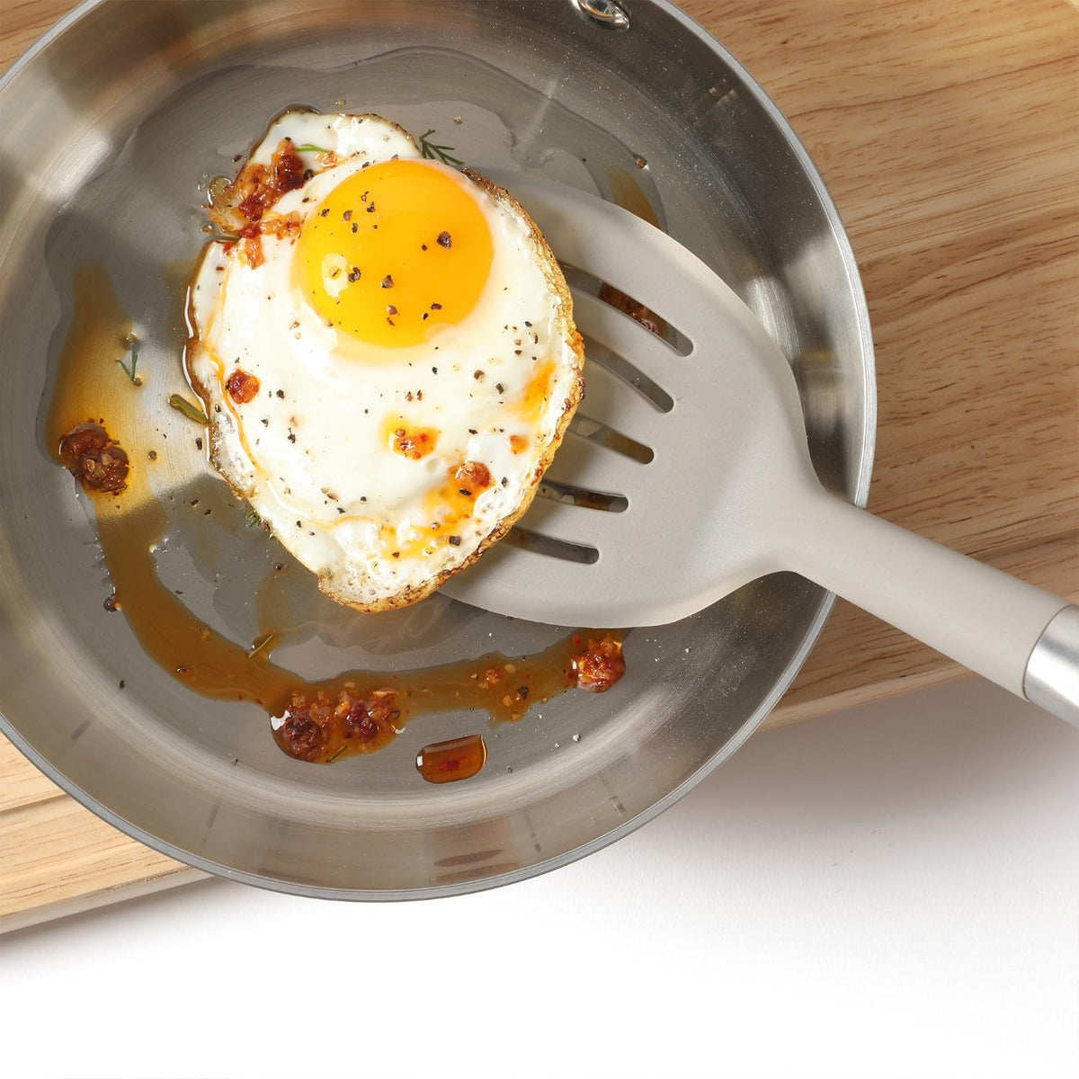 Calphalon Prime slotted turner stores neatly in a utensil holder with slim profile.