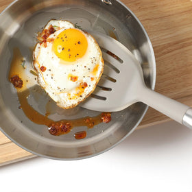 Calphalon Prime slotted turner stores neatly in a utensil holder with slim profile.