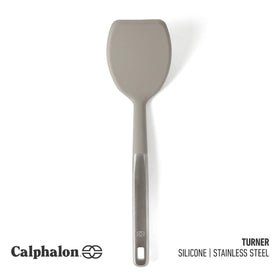 Calphalon Prime turner with stainless steel handle provides a secure grip.