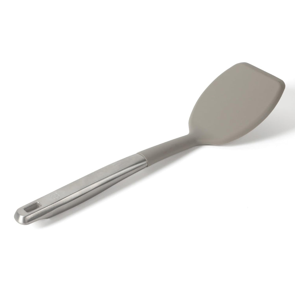 Calphalon Prime turner with taupe silicone head for gentle nonstick flipping.