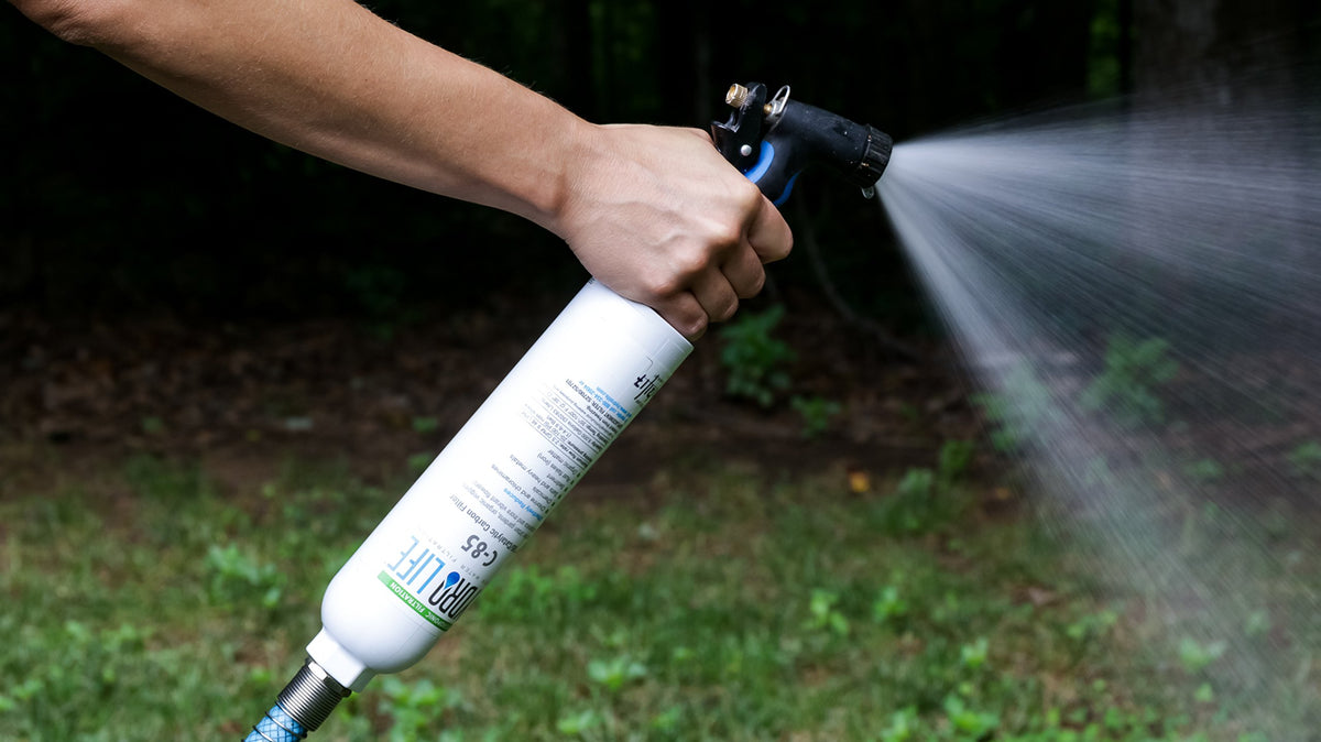 Camco Hydro Life hose protector reducing strain on faucet connections.
