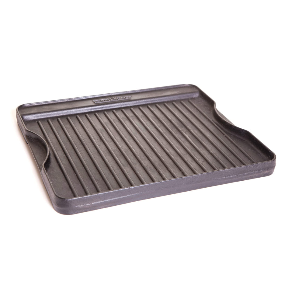Camp Chef reversible griddle flat side for versatile cooking with smooth, even heat.