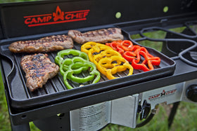 Camp Chef griddle ribbed side sears burgers and veggies with distinct marks.