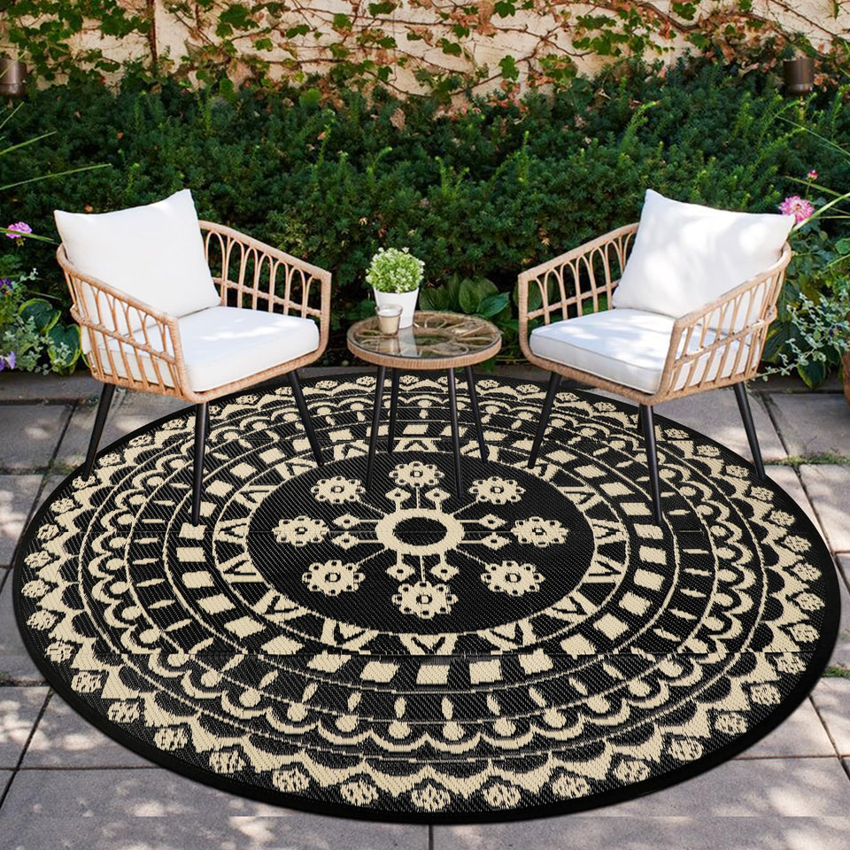 Capslpad 6ft round outdoor rug shown on a sunny patio, waterproof and reversible
