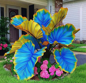 Large-leaf Caladium leaves provide dramatic color against greens.