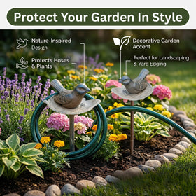 Carvers Olde Iron garden hose guide stake near flower beds directs watering