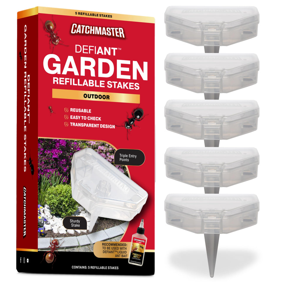 Catchmaster DEFIANT outdoor stake trap placed in soil for durable garden pest control