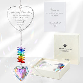 Ceegook sister crystal suncatcher with heart prisms creating colorful reflections.