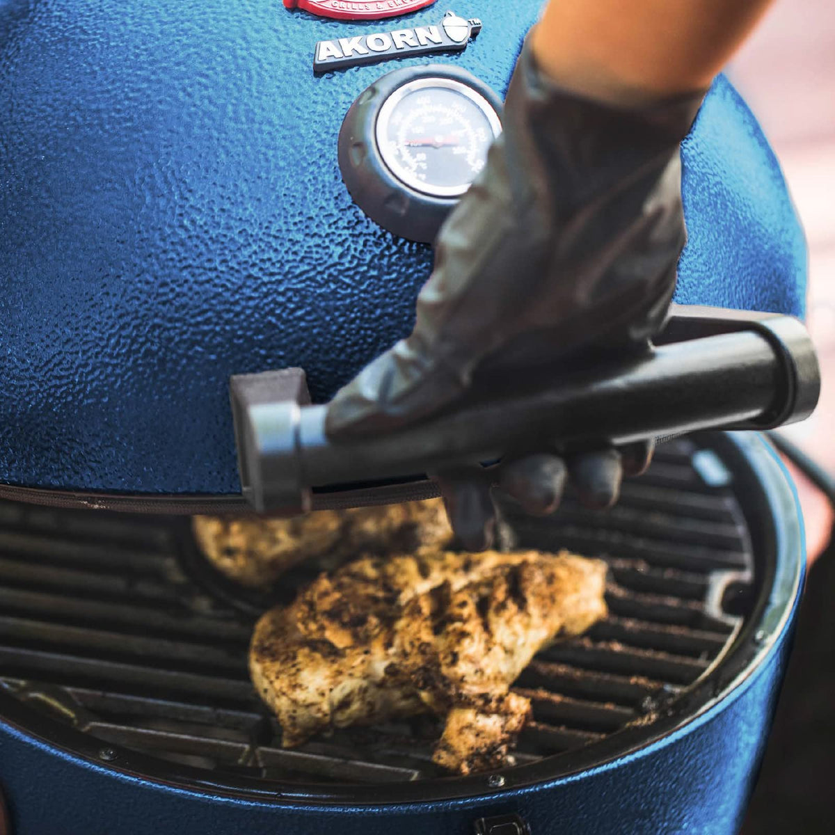 Char-Griller AKORN Jr Smokin' Stone supports pizzas and cookies with even heat.