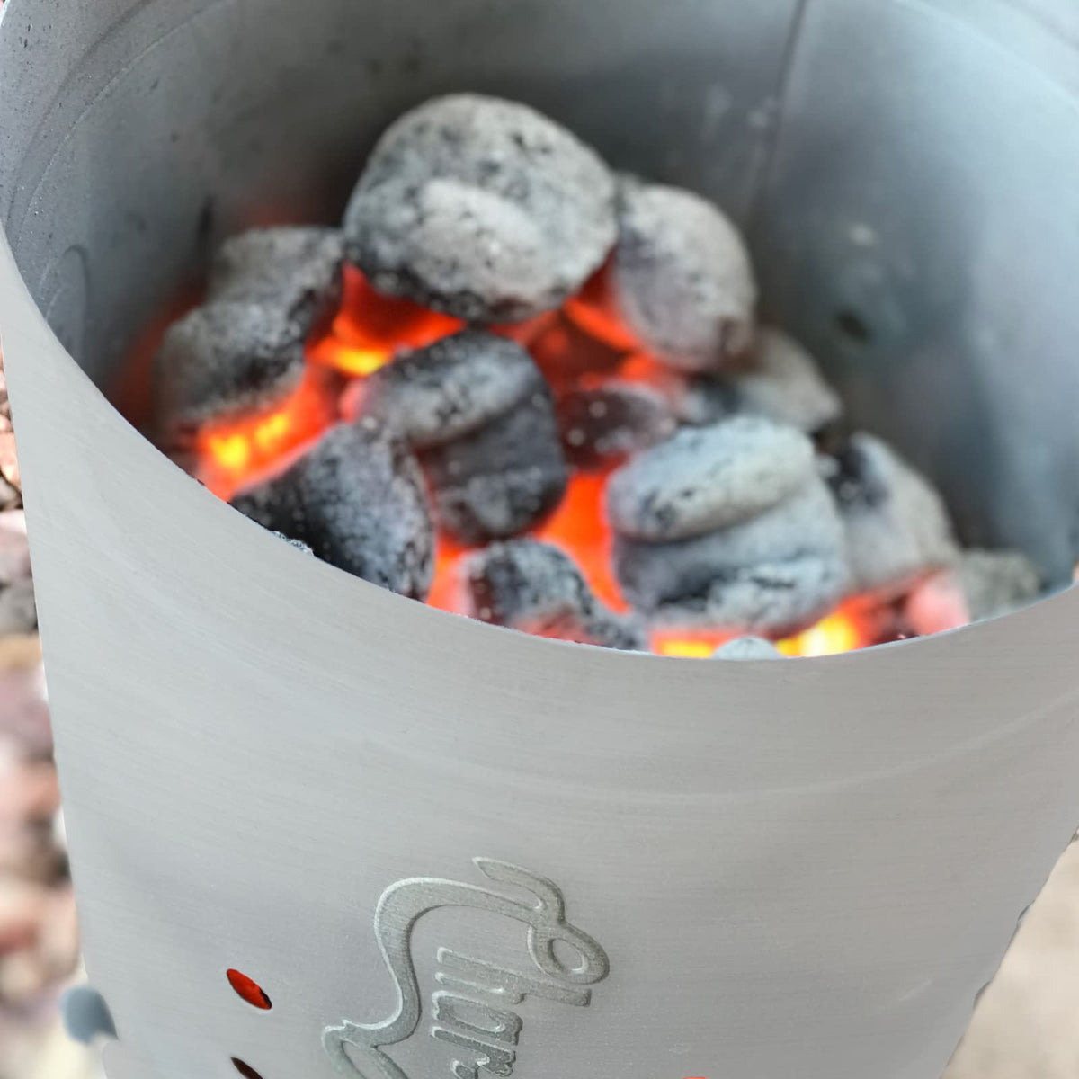 Char-Griller chimney starter shows air vents for efficient burning.