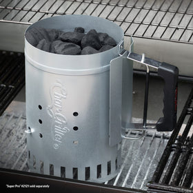 Char-Griller chimney starter dumping coals with quick-release trigger.