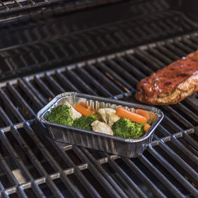 Charbroil drip pans in use on a grill for straightforward cleanup after cooking