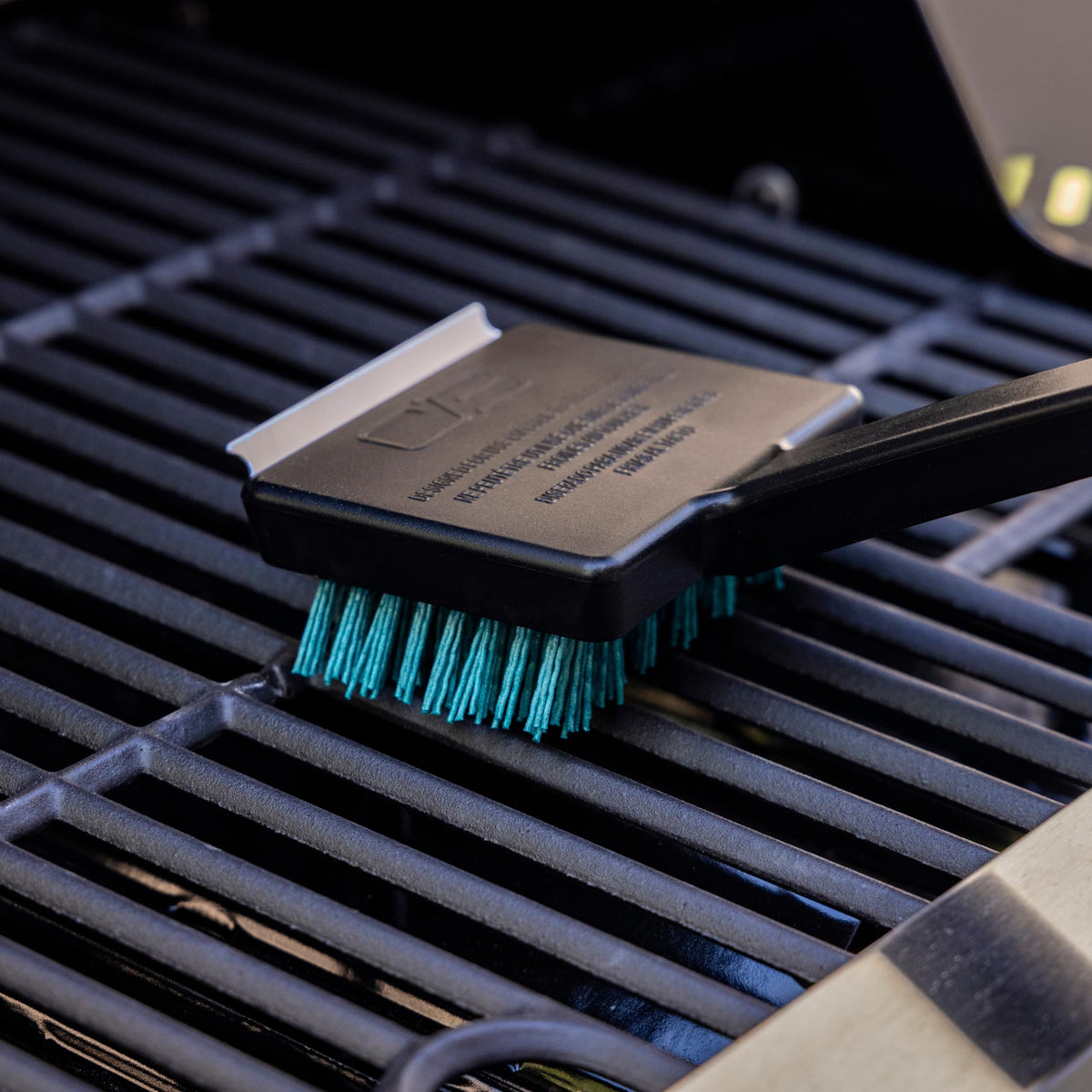 Charbroil hanging hook keeps the brush within reach after use.