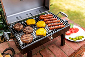 Charbroil grill's sturdy steel construction with heat-resistant handles for outdoor use.