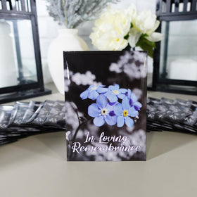 Choobly memorial seed packet display on a table for elegant service decor.