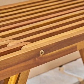 Teak toned acacia wood suits coastal or modern outdoor decor.
