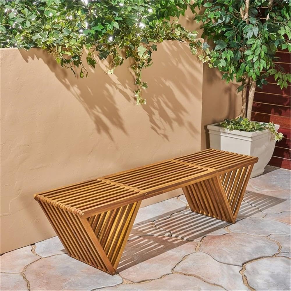 Esme bench side view highlights teak finish and sturdy acacia construction.