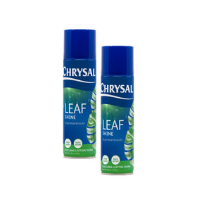 Chrysal Leaf Shine bottle shown during spray application on plant leaves