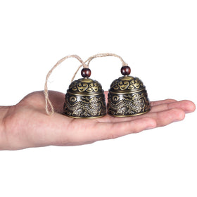 Chuangdi dragon fish cloud motif bell complements doorway with auspicious symbolism.