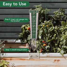 Circrane rain gauge on post illustrates simple garden monitoring.