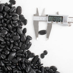 CJGQ Black Pebbles ideal for aquarium decor and color contrast.