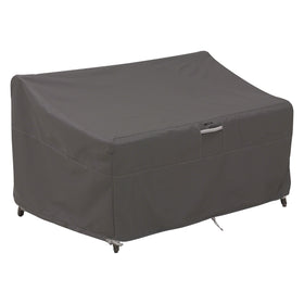 Classic Accessories Ravenna loveseat cover protecting deep-seated furniture from rain and sun.