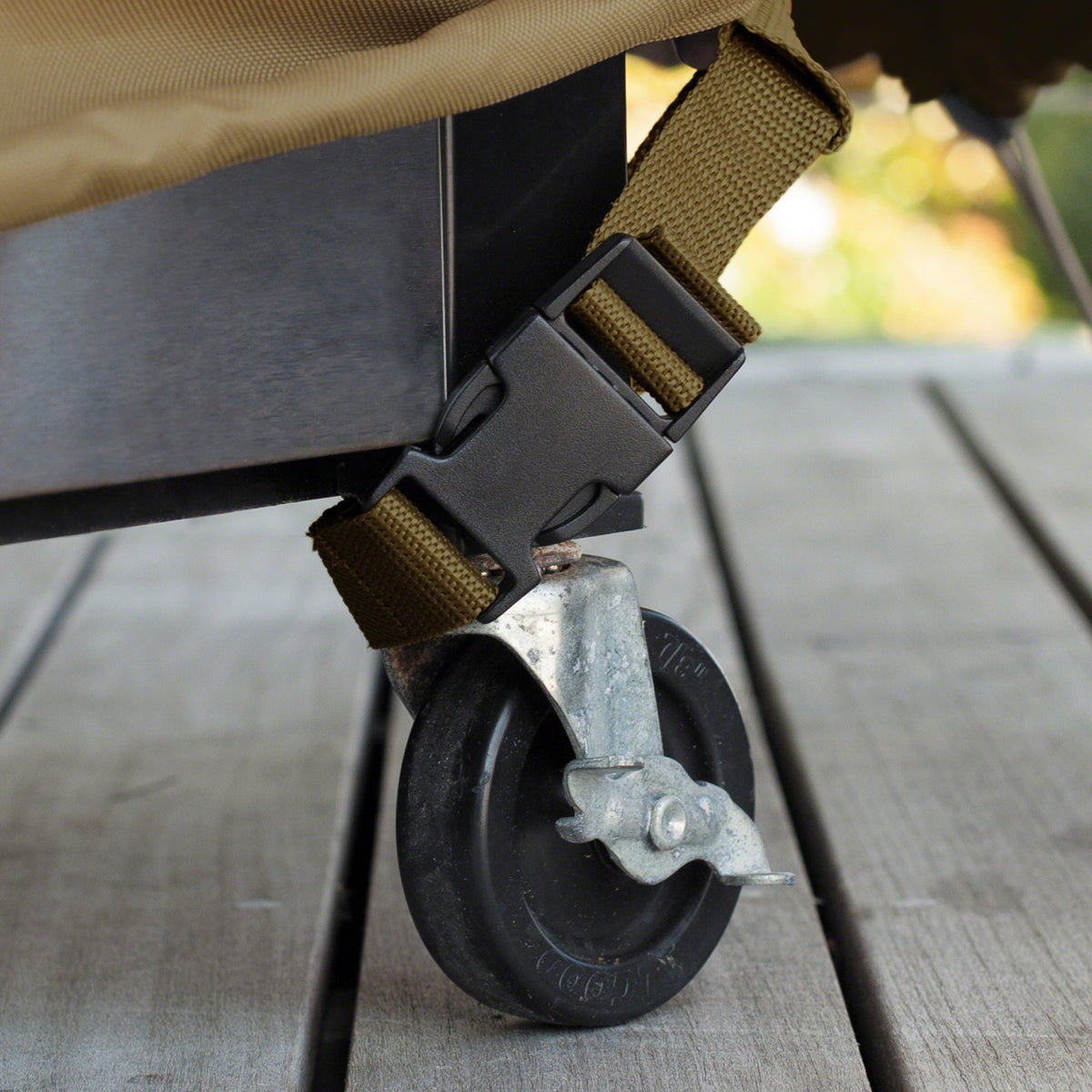 Classic Accessories Veranda cover with adjustable straps secures on windy days.
