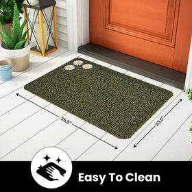 Daisy Urban Green mat with grass-like blades reduces tracked dirt at threshold.