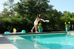 CLOROX Pool & Spa alkalinity increaser powder dissolving into water for quick dosing.