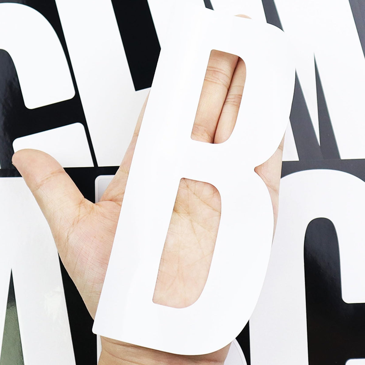 CMBBZZY 6-inch white letter sticker on truck for durable outdoor signage.