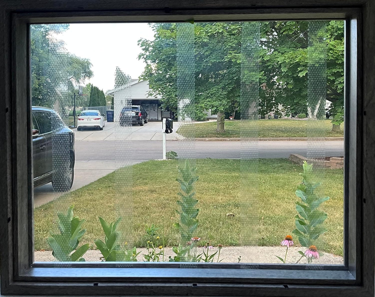 CollidEscape Spiderweb Clear BirdTape preserves yard views while adding protection.