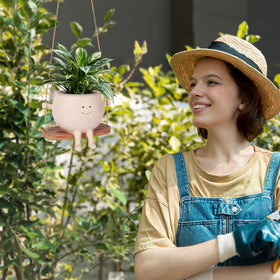 CONNOVA indoor-outdoor smiley planter enhances shelves, porches, and patios.