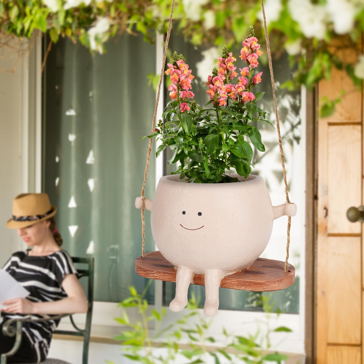 CONNOVA smiley-face hanging planter suitable for indoor or outdoor use.